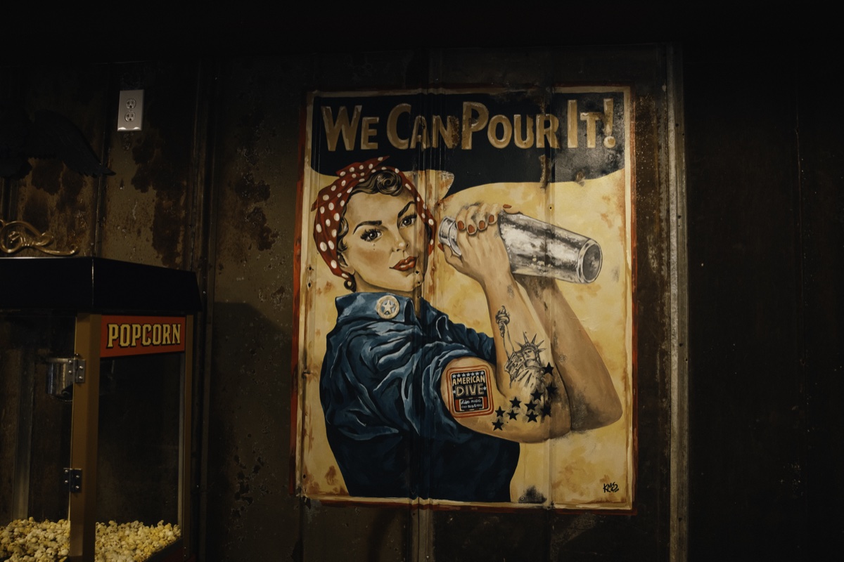 The We Can Pour It mural beside the popcorn machine.